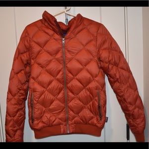 Dark orange, Poofy, warm coat.